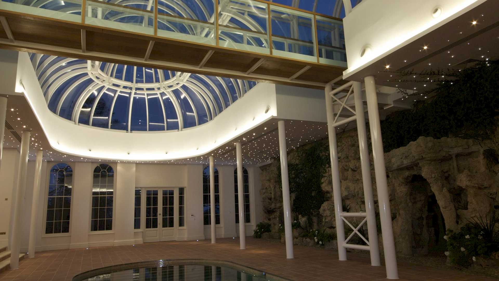 Pool area of winter garden showing lighting scene
