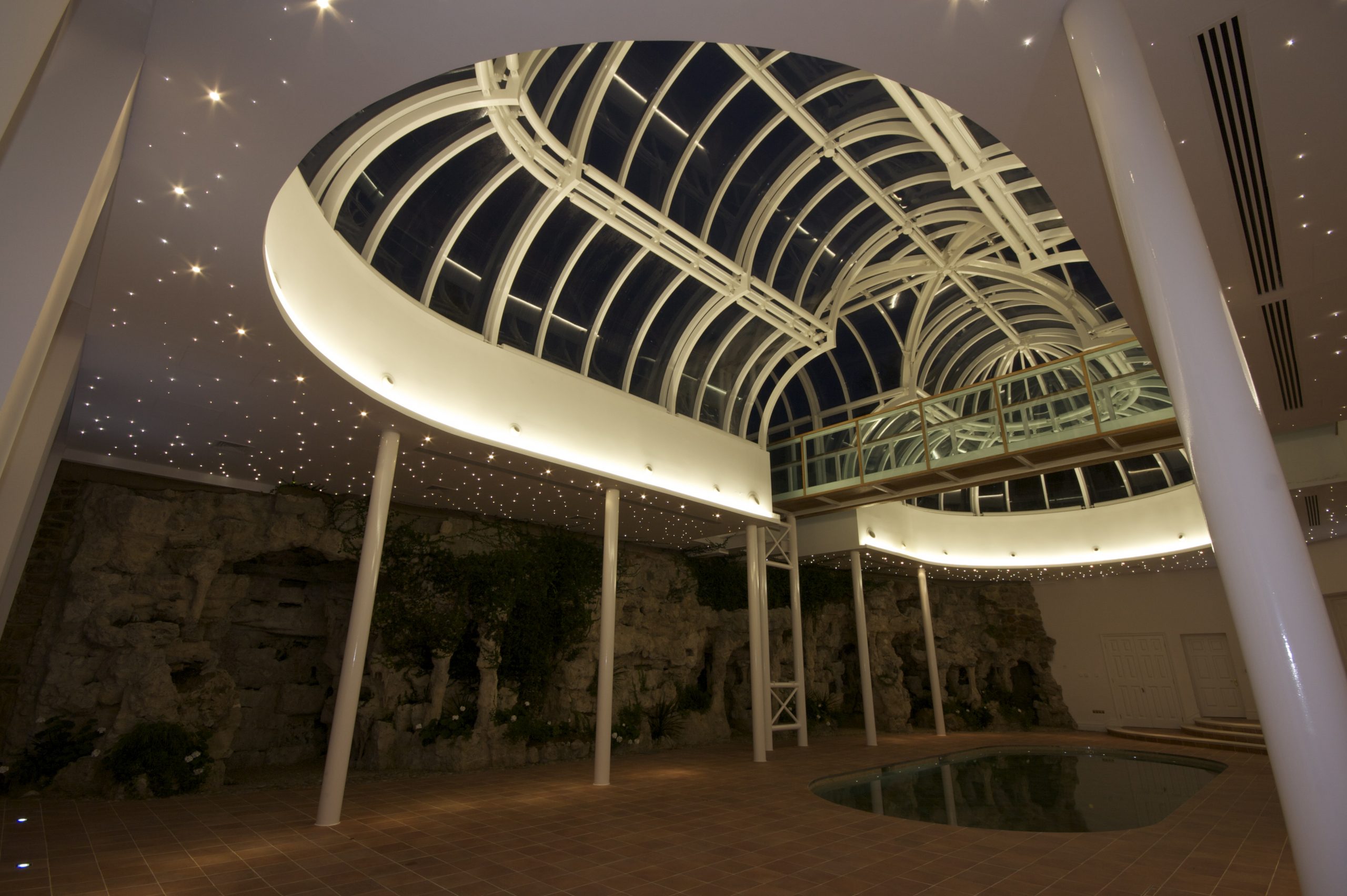 Shows Crestron lighting in winter garden, with pool