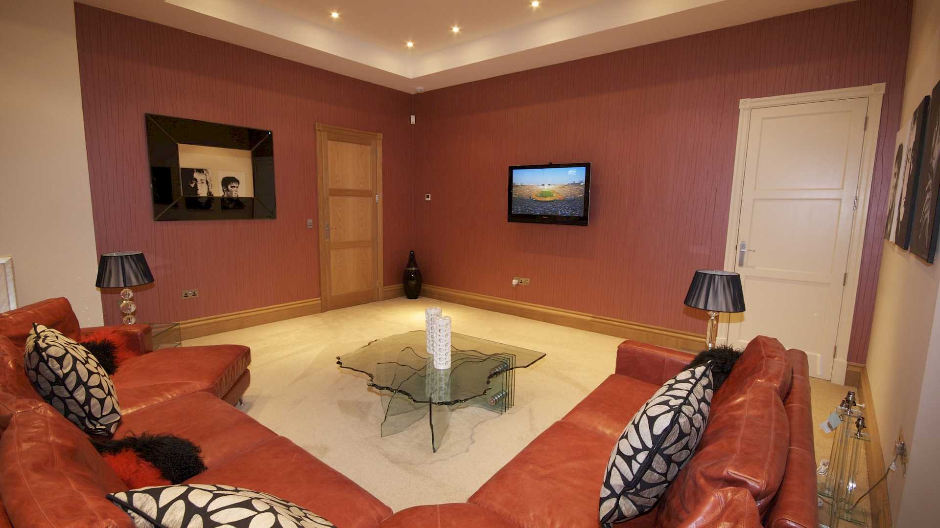 Family room with invisible speakers, part of a whole home technology solution.
