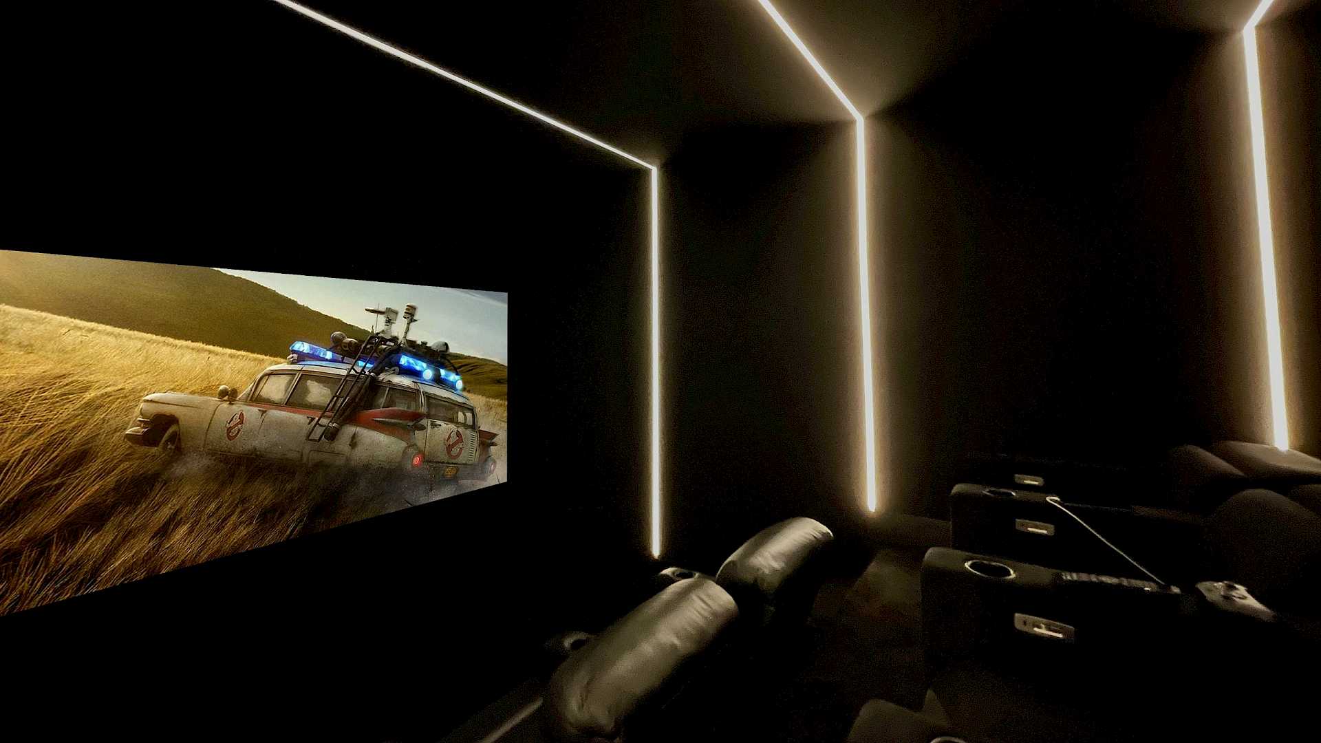 Home cinema with lighting, seating and a film playing.