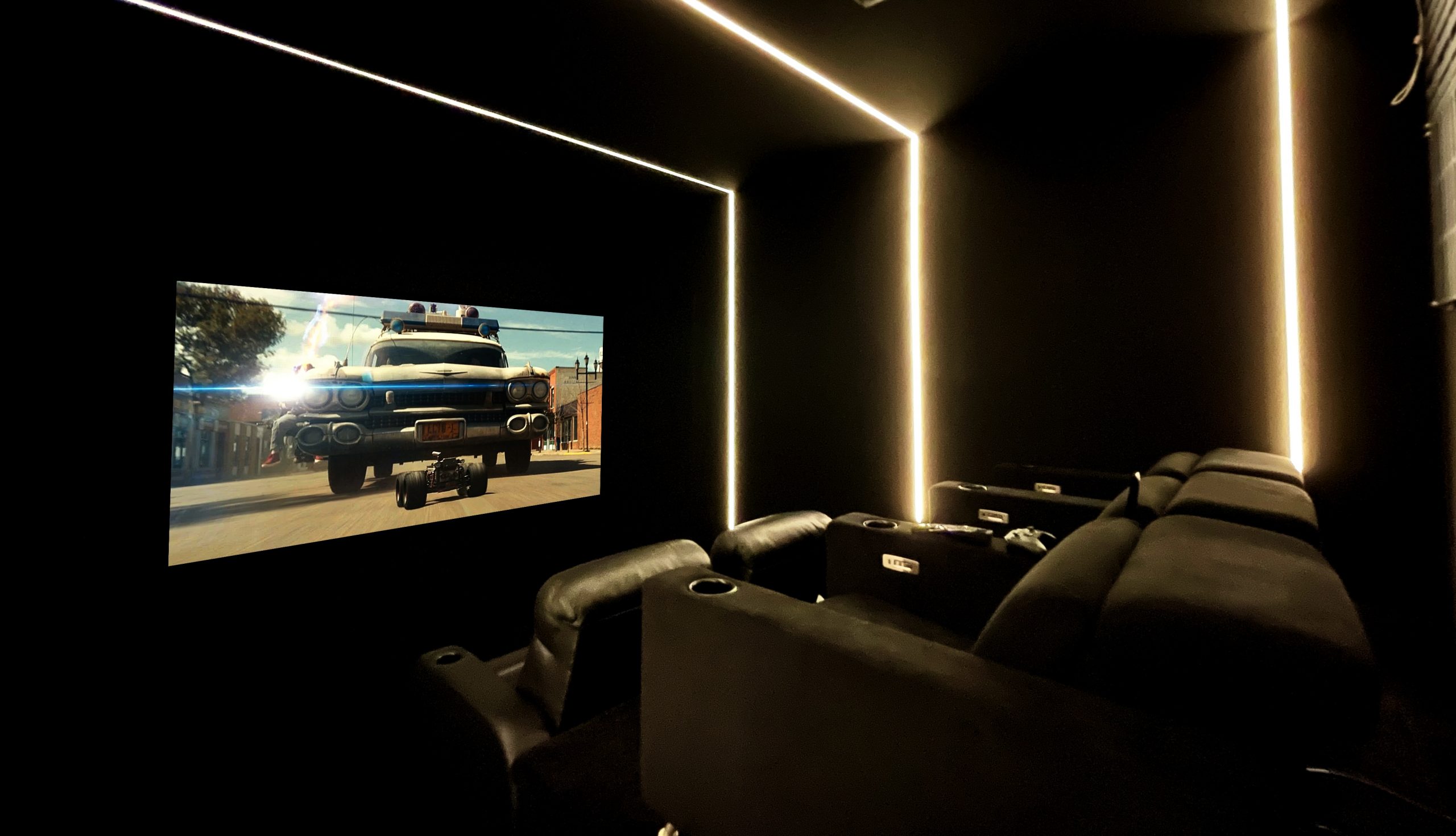 Home cinema from side, shows screen and seating.