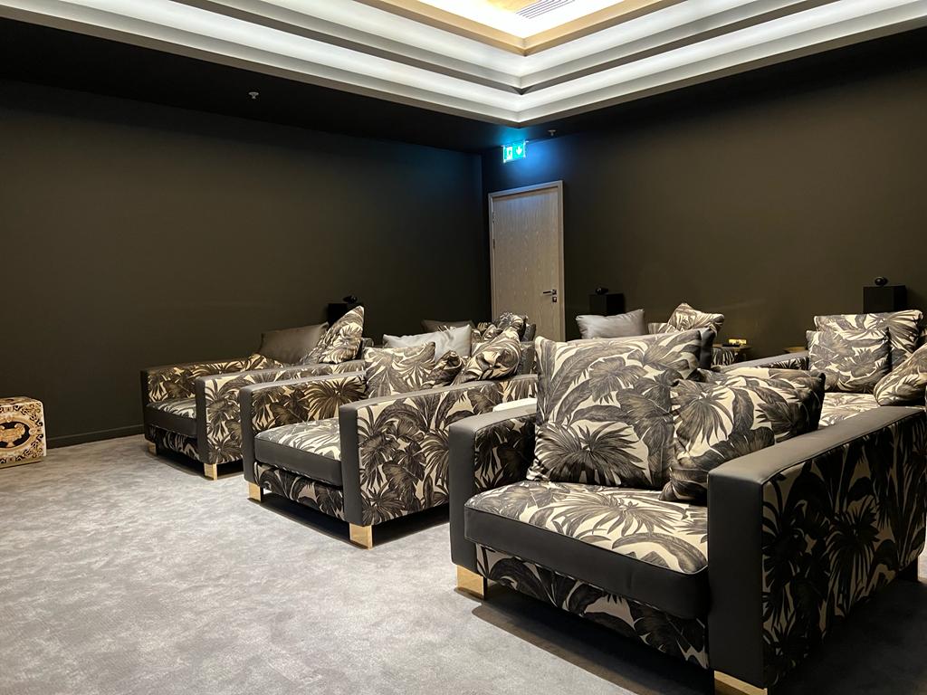 Seating in MDU communal cinema room.