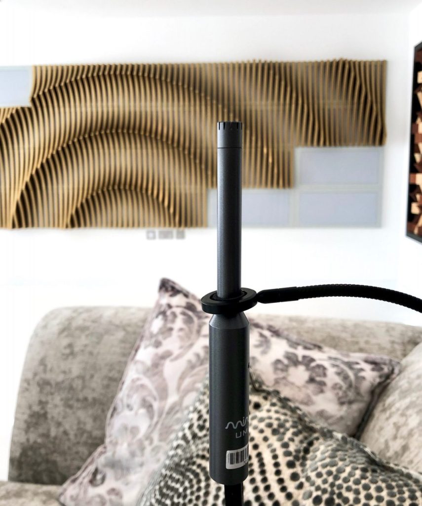 Acoustic analysis of the room, shows equipment and treatment in background.