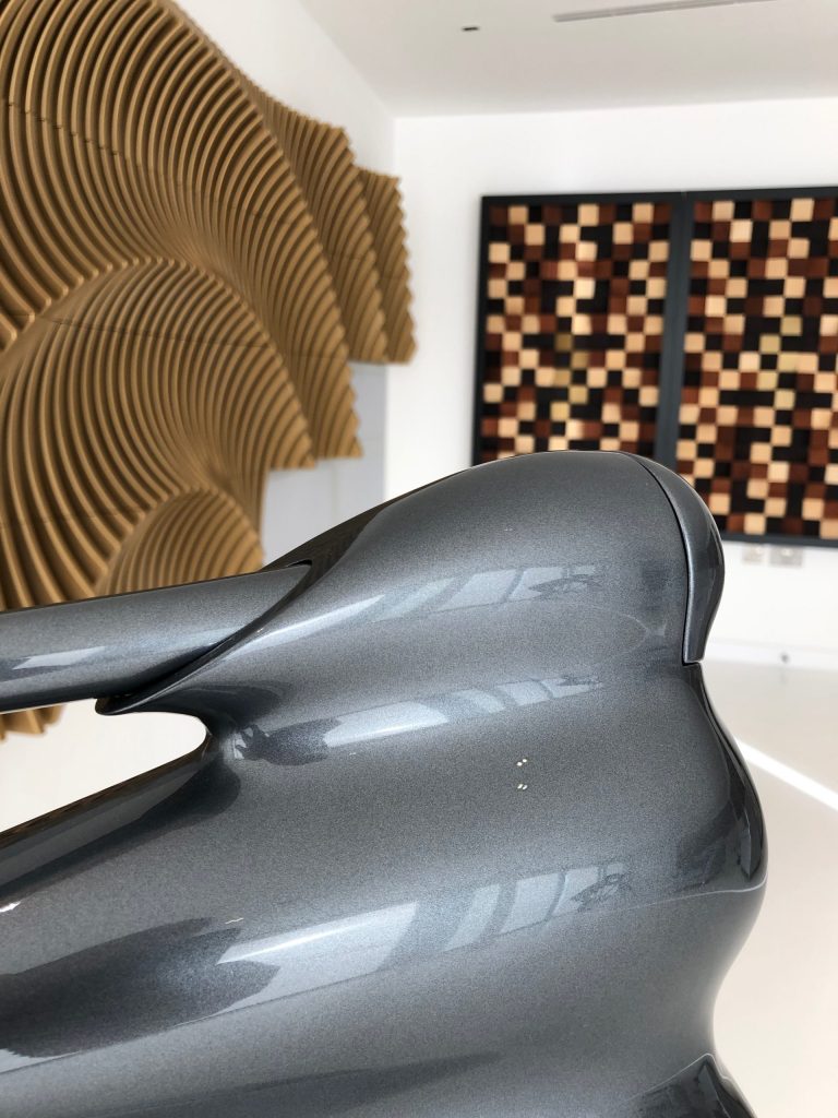 Bowers and Wilkins Nautillus loudspeaker with acoustic room treatment in background.