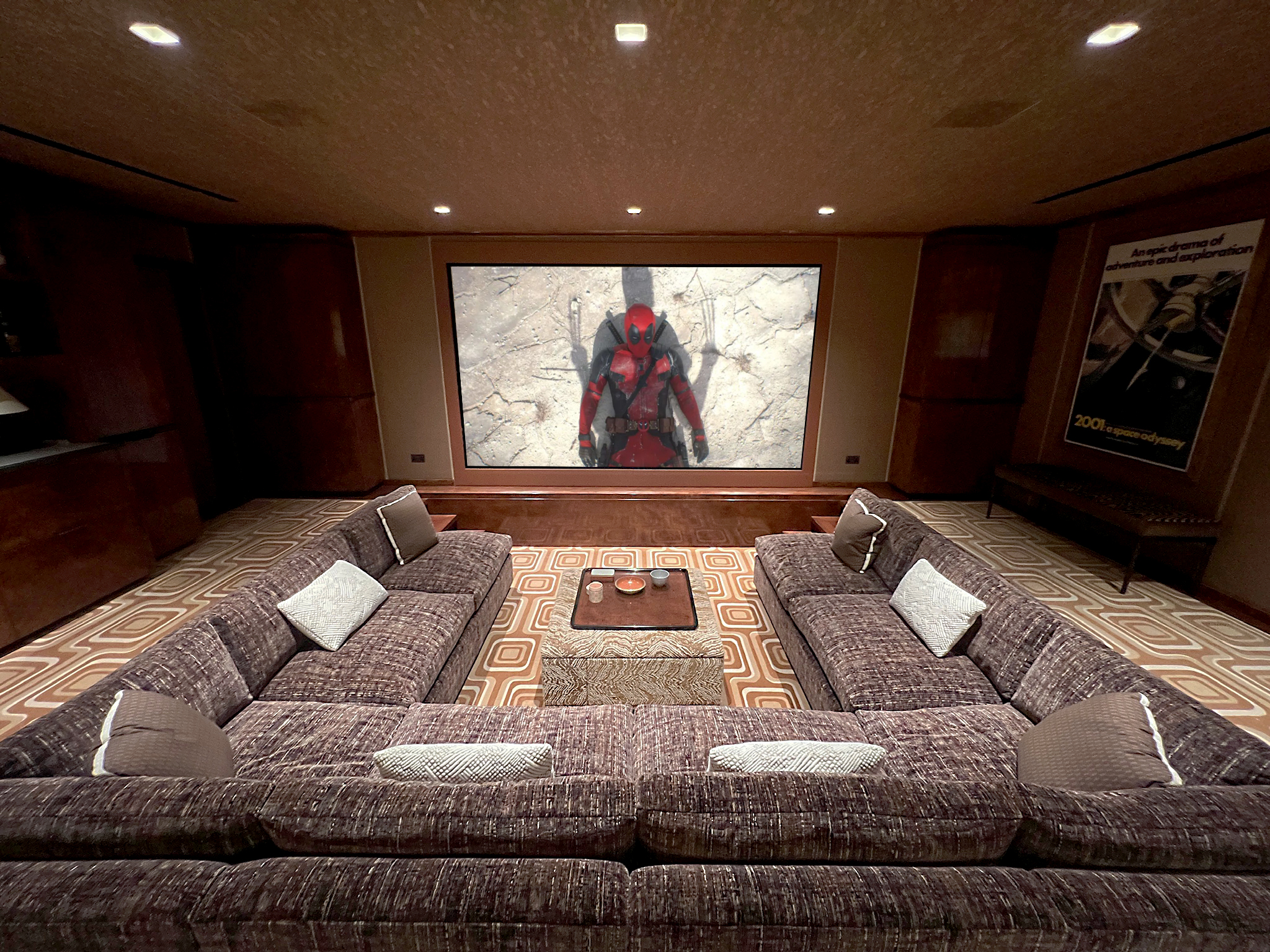 Sunken seating in this cinema. Shows seats and screen.