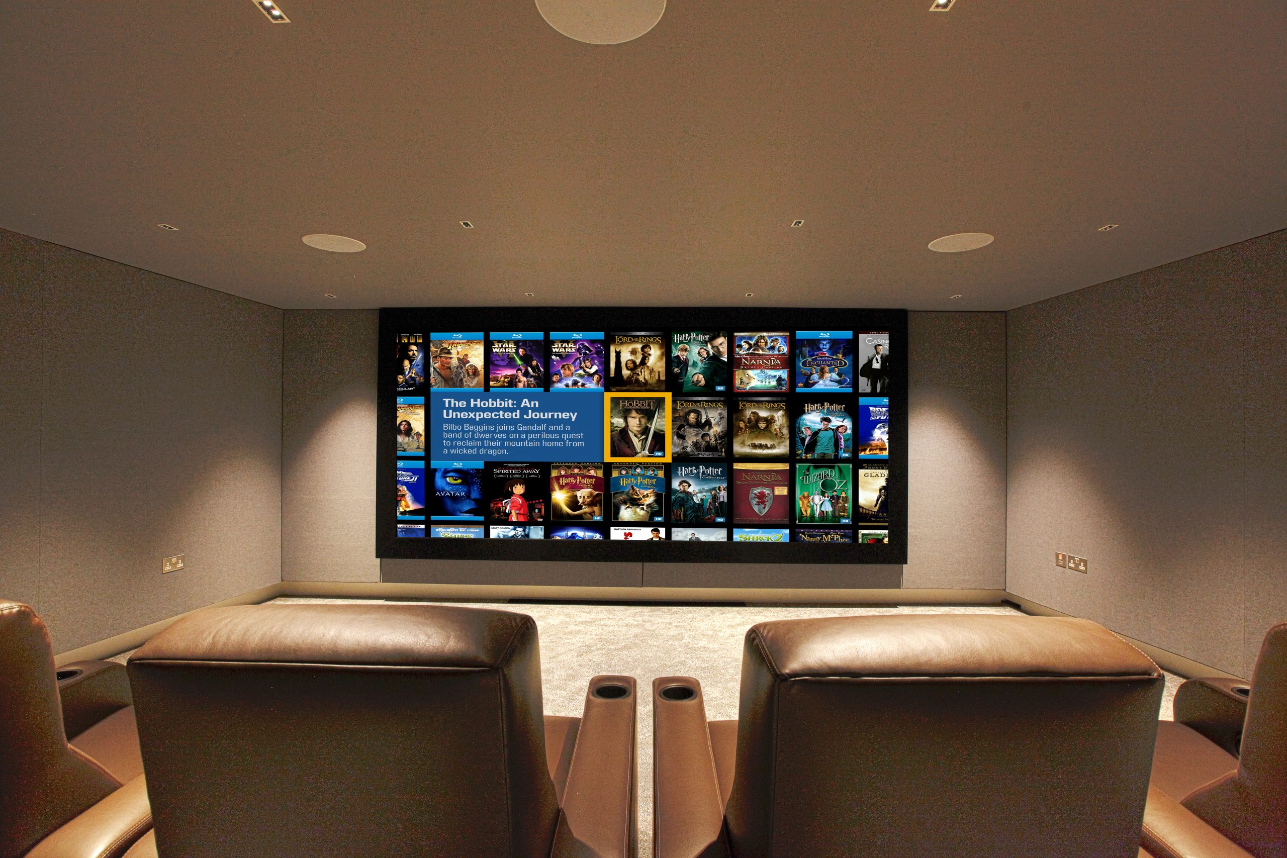 Home cinema room with immersive audio, Trinnov processing and Bowers and Wilkins in wall loudpseakers. Looking at screen from seating position. This image features in our how much does a home cinema cost article.