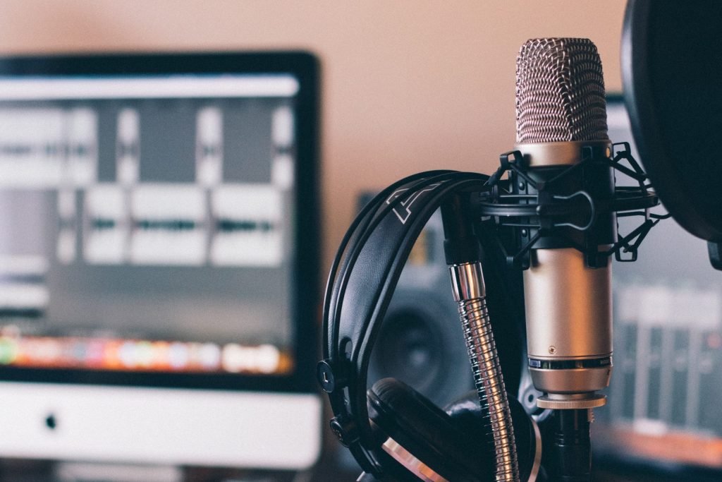 Image shows mic and headphones in home studio